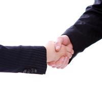 Handshake of two business partners isolated on white